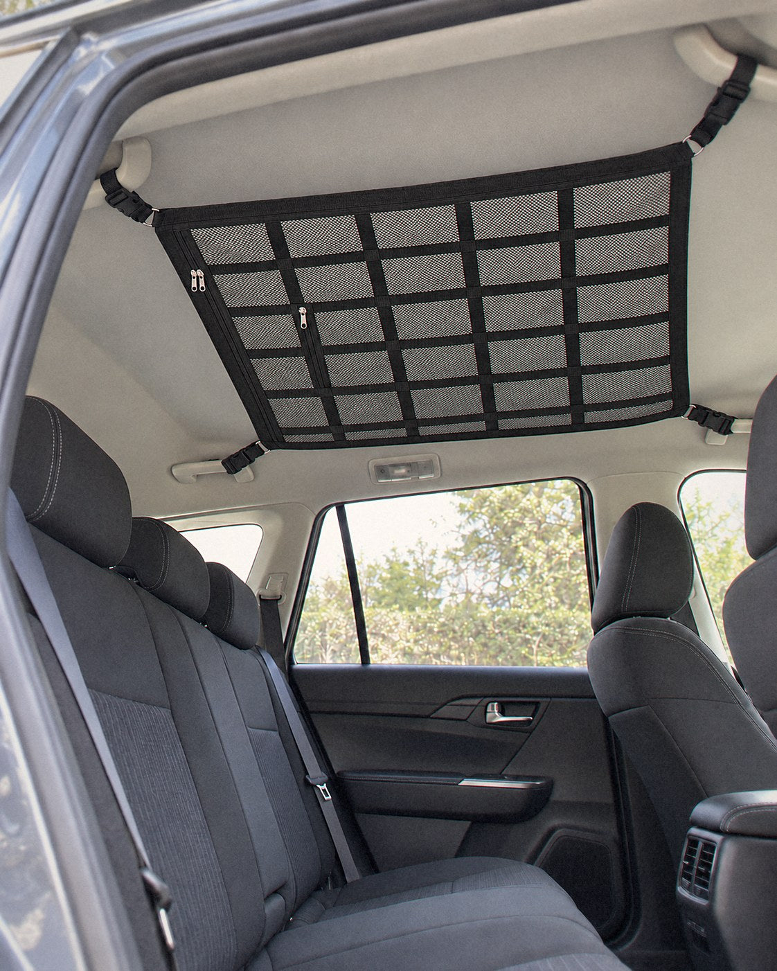Overhead cargo net fitted in an SUV, seen through an open back door